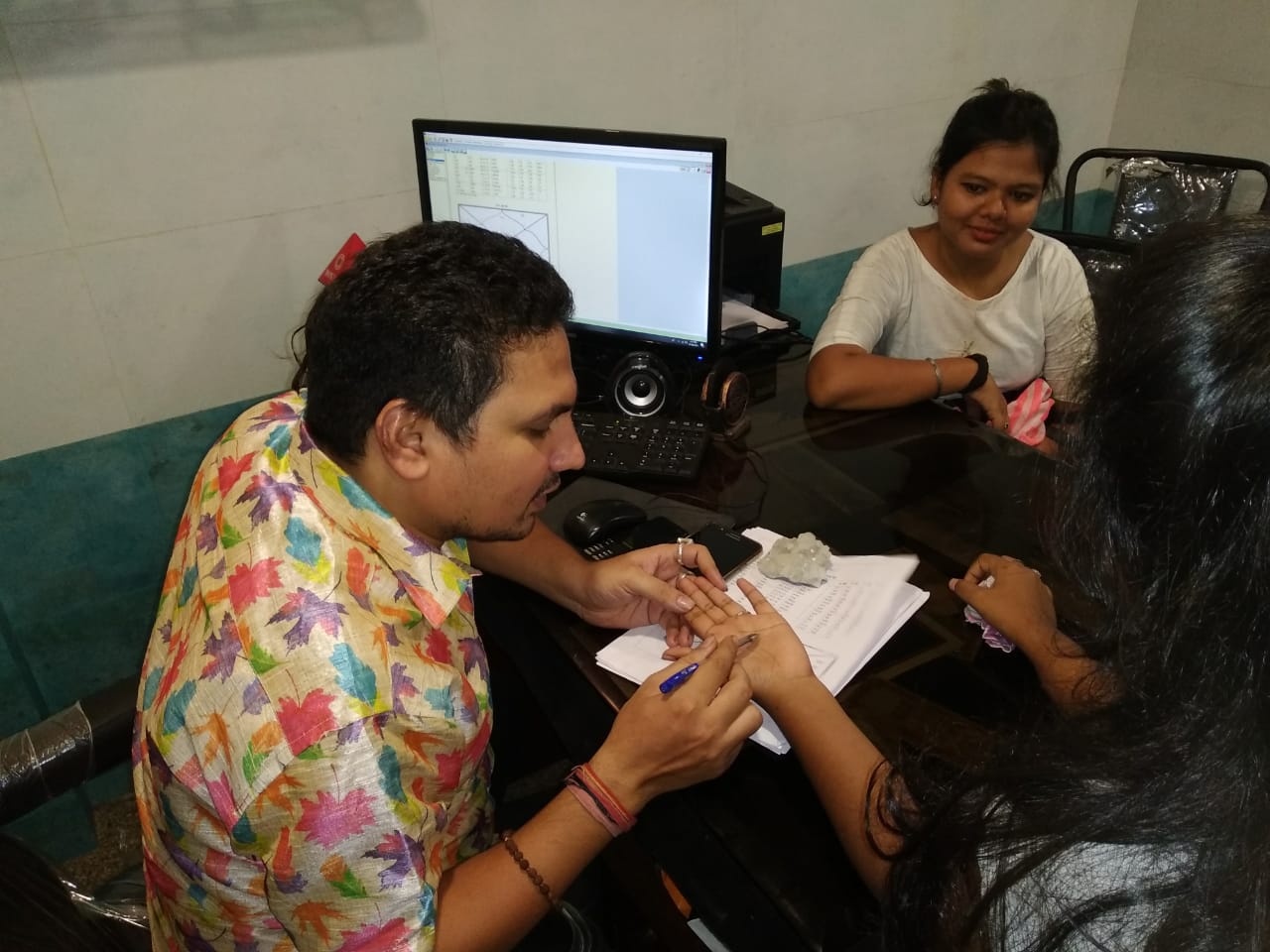 Reading the lines of a palm during a consultation
