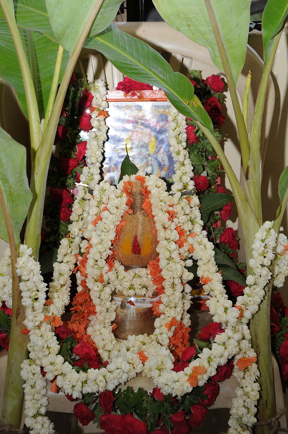 A garlanded kalash prepared for a ceremony